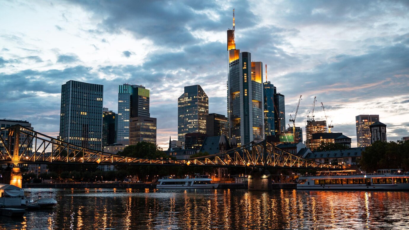 The photo shows the Skyline of Frankfurt at sunset.